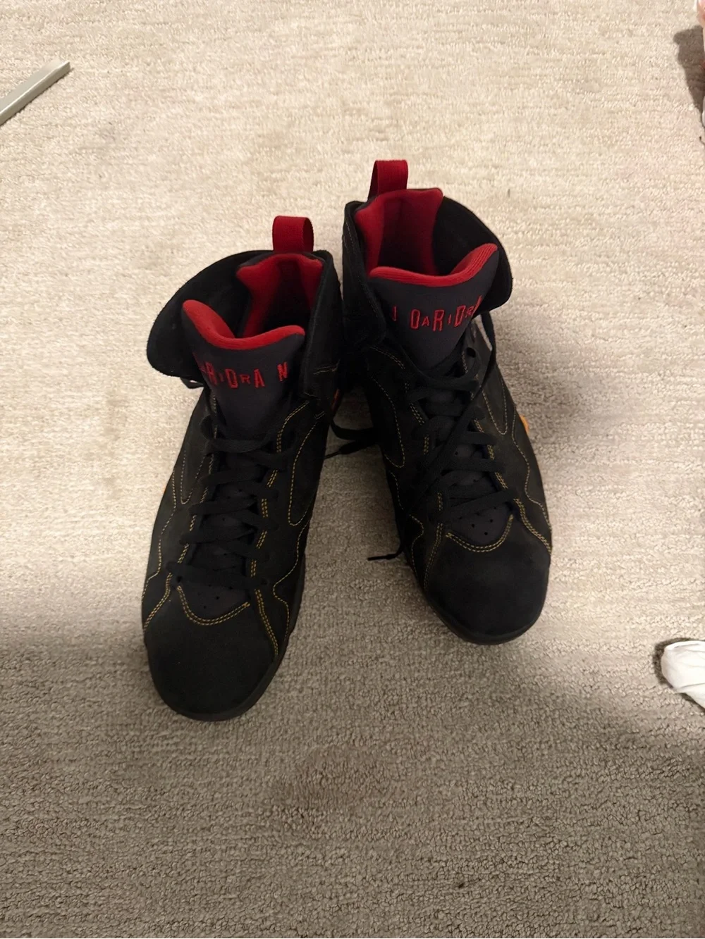 Jordan Black Sneakers with Red Pull Tabs and Yellow Accents